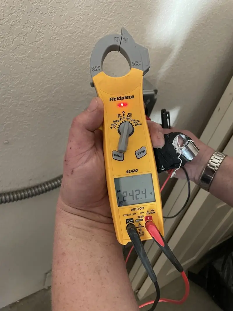Voltage testing with clamp meter during Whole House Surge Protector in Stapleton